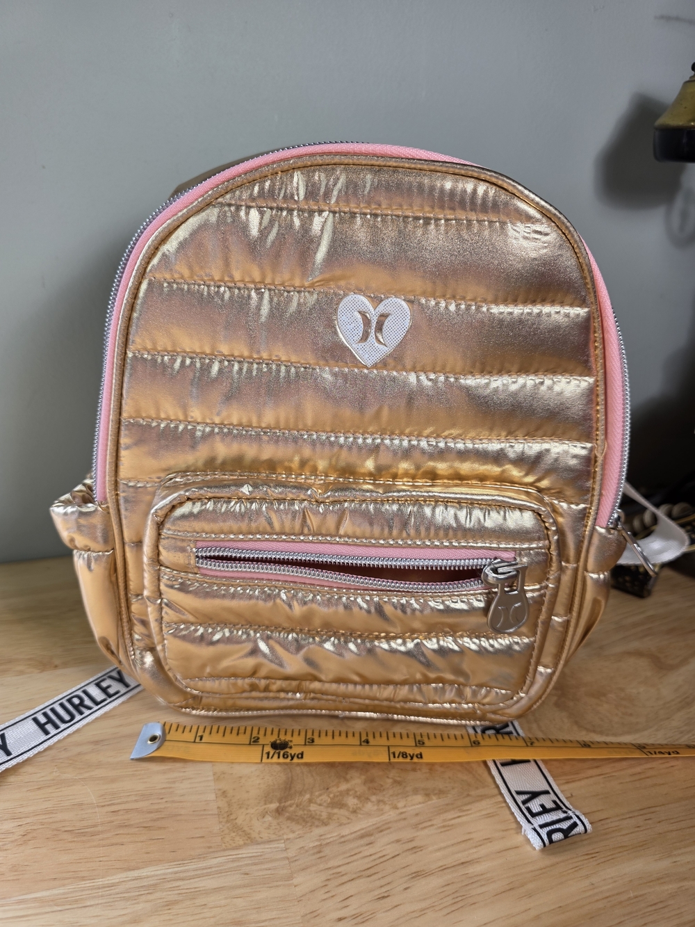 NWT Hurley Metallic Rose Gold Mini Bag with Pink Trim
